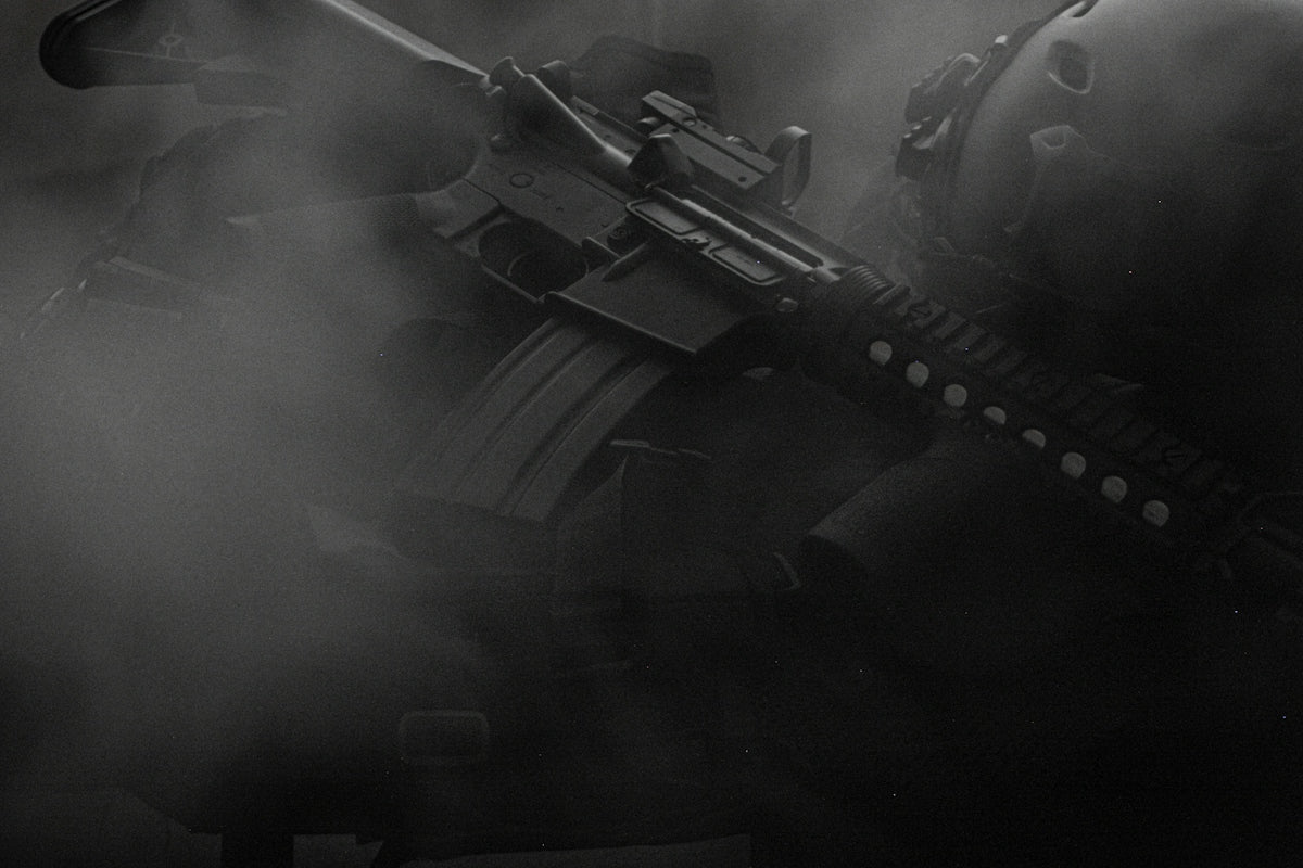 black assault rifle on black textile