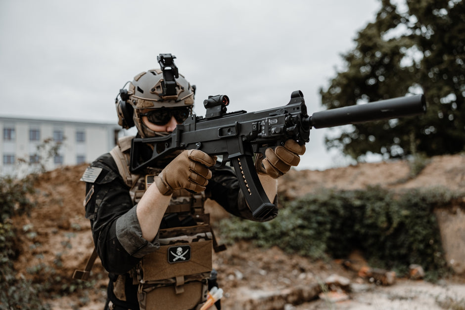 a man with a gun in his hand