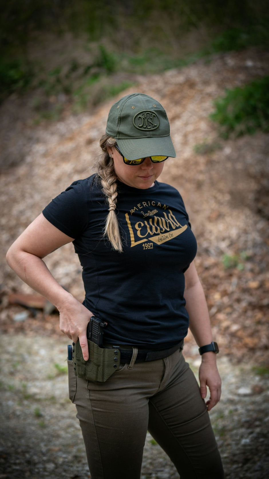 A woman wearing a hat and a black shirt