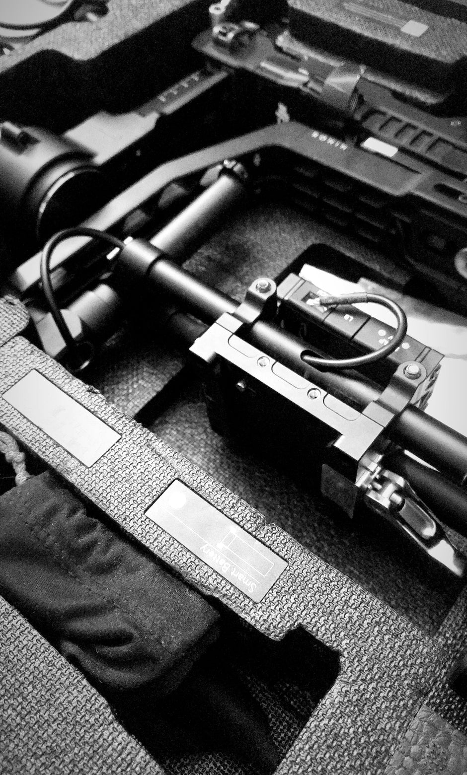 A black and white photo of a gun and other items