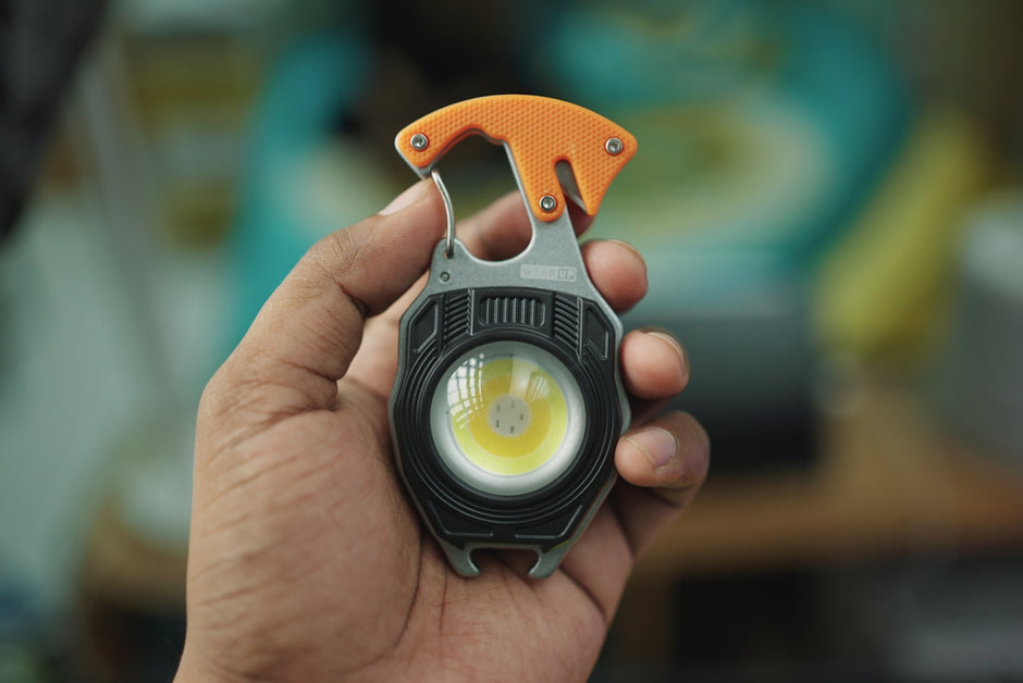 A person holding a flashlight in their hand