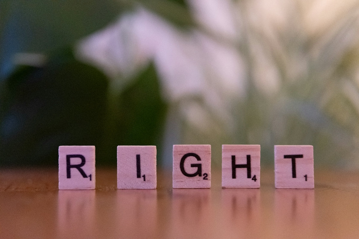 The word right spelled with scrabble blocks on a table