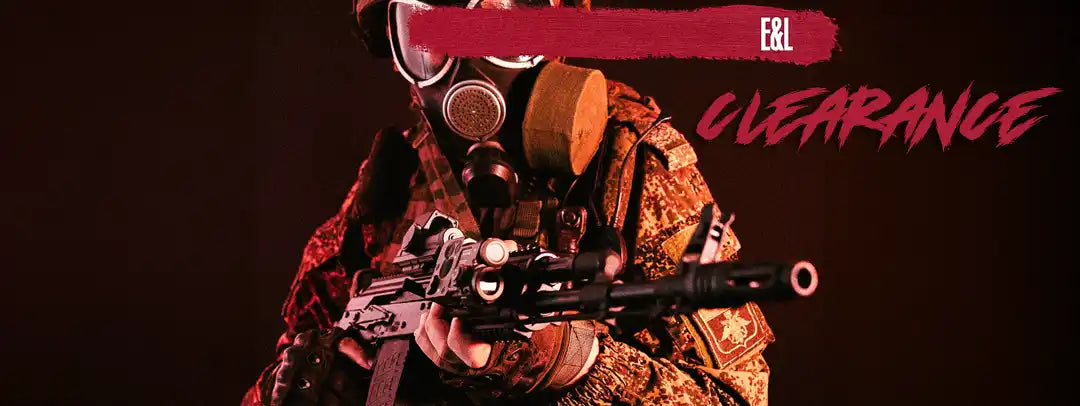 A person in military camouflage and a gas mask holding a rifle.
